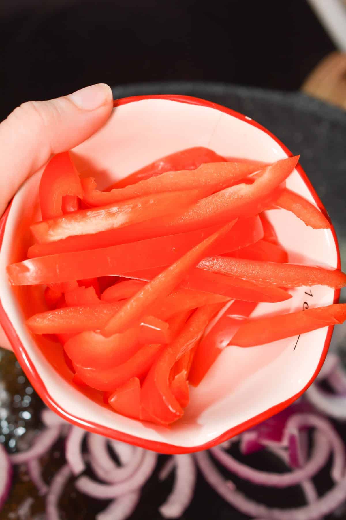 peppers going into skillet