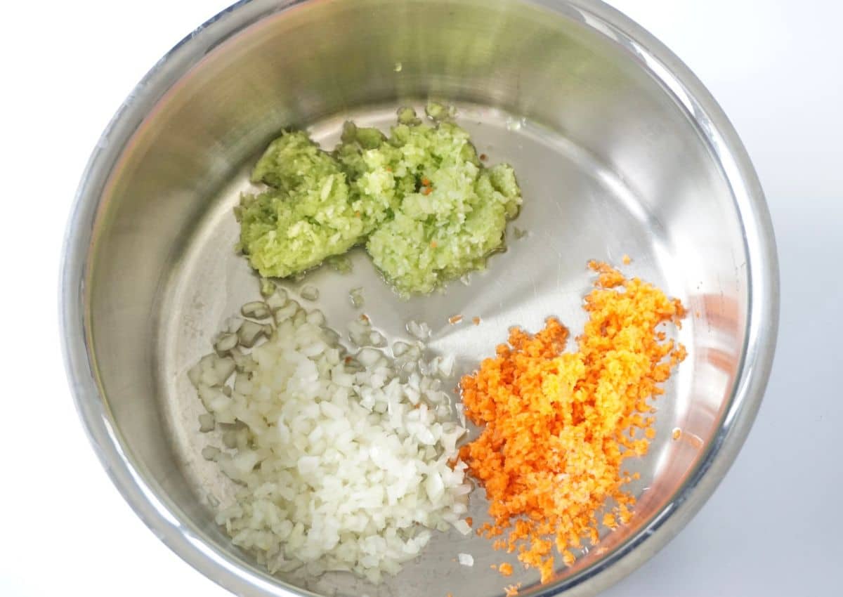 onion, celery, carrots going into pot